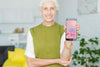 Senior Woman Holding Smartphone Mockup Psd