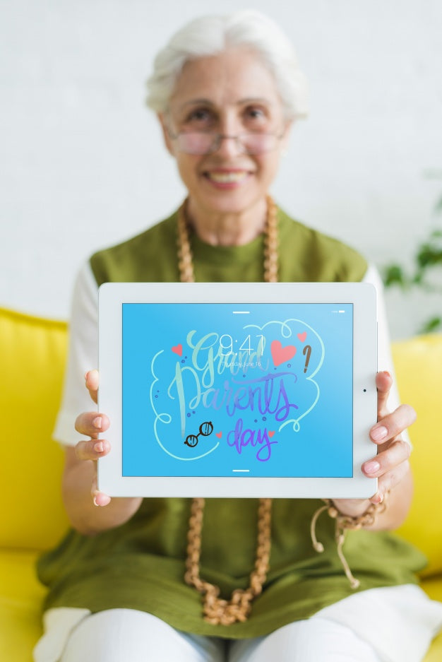 Senior Woman Holding Tablet Mockup Psd