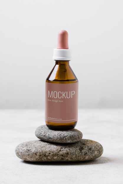 Serum Bottle On Rocks Stack Psd