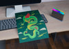 Sheet With Colorful Snake Design On Desk Psd