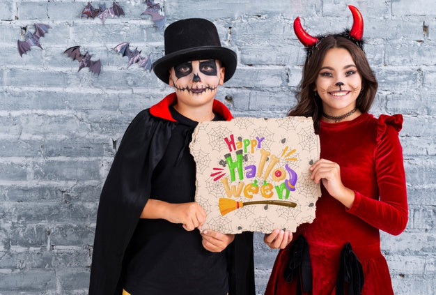 Siblings Showing A Happy Halloween Card Medium Shot Psd