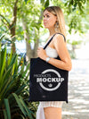 Side View Blonde Woman Holding A Black Bag Mock-Up Psd