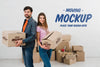 Side View Of Couple Posing With Moving Boxes Psd