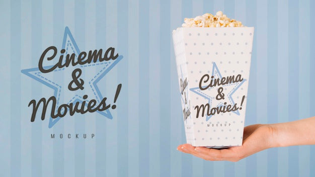 Side View Of Hand Holding Cup Of Popcorn Psd