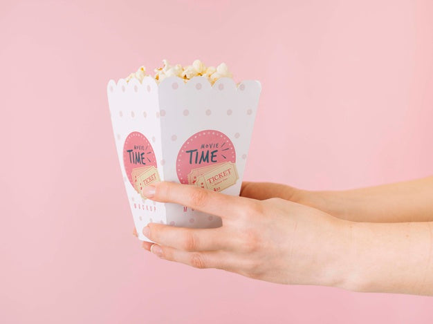 Side View Of Hands Holding Popcorn Cup Psd
