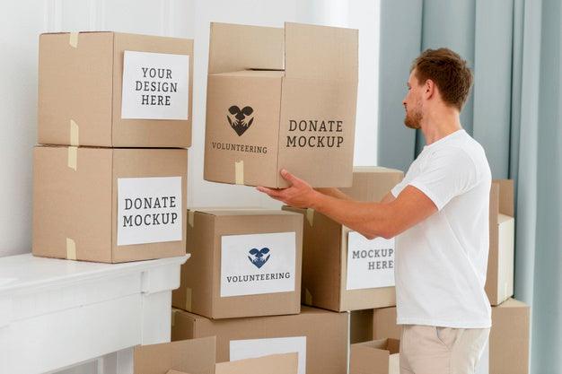 Side View Of Male Volunteer With Donation Boxes Psd