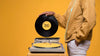 Side View Of Man Holding Vinyl Disk For Music Store Mock-Up Psd