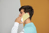 Side View Of Man Talking On Smartphone Psd