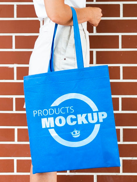 Side View Woman Holding A Plain Blue Bag Mock-Up Psd