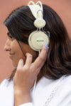 Side View Woman Listening To Music Through Headphones Psd