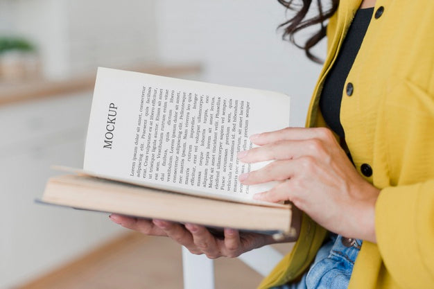 Side View Woman Reading From A Mock-Up Book Psd