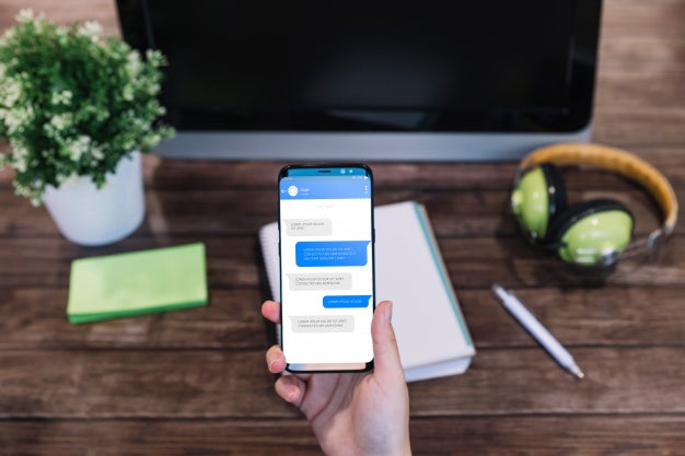 Smartphone Mockup In Front Of Computer Psd
