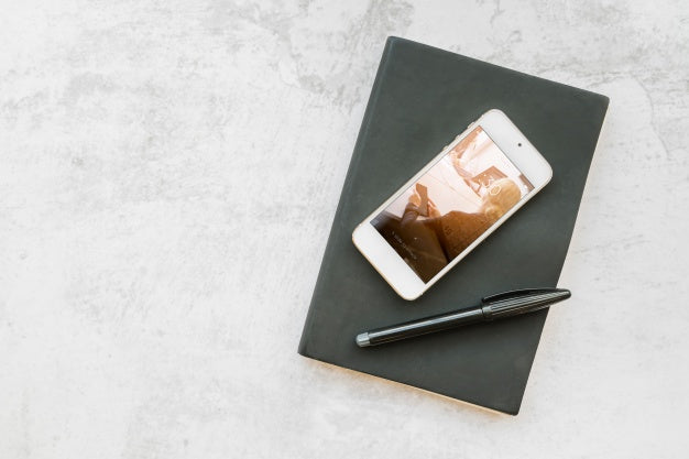 Smartphone Mockup On Book Psd