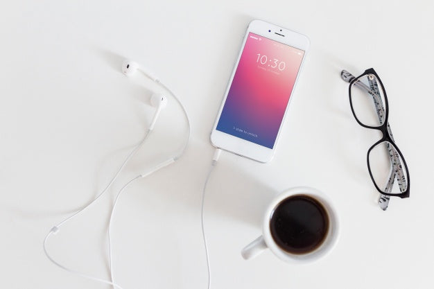 Smartphone Mockup With Charging Cable And Earphones Psd