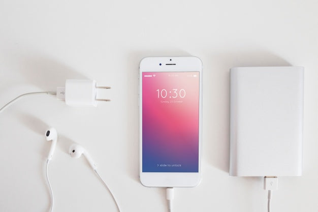 Smartphone Mockup With Charging Cable And Earphones Psd