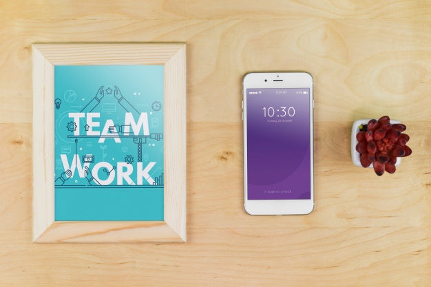 Smartphone Mockup With Office Materials On Table Psd