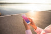 Smartphone Mockup With Woman At The Beach Psd