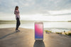 Smartphone Mockup With Woman At The Beach Psd
