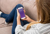Smartphone Mockup With Woman Chilling On Couch Psd