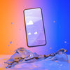 Smartphone With Weather App And Colorful Liquid Background Psd