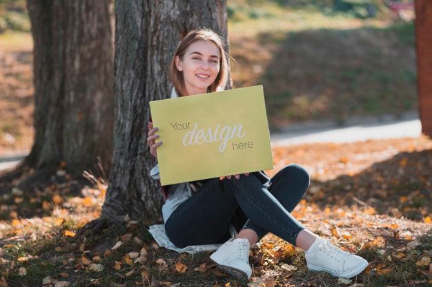 Smiley Blonde Girl Holding A Banner Mock-Up Psd