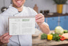 Smiley Chef Holding A Recipe Mock-Up Psd