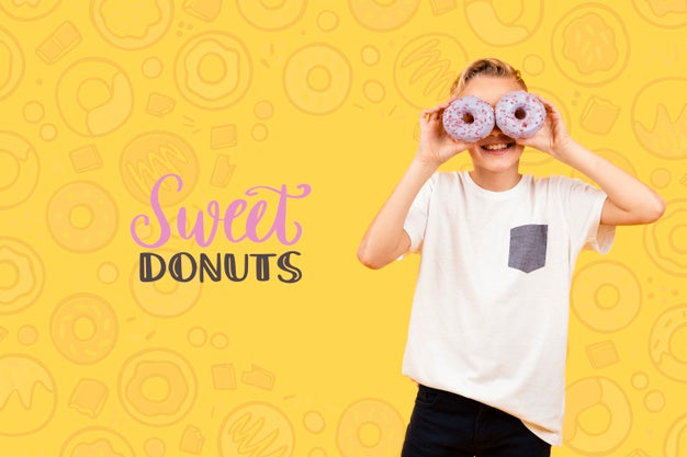 Smiley Child Posing With Donuts Over Eyes Psd