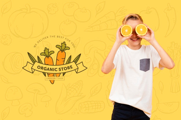 Smiley Child Posing With Oranges Over Eyes Psd