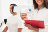 Smiley Female Doctor Holding Mock-Up Clinical Card Psd