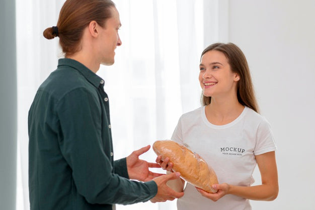 Smiley Female Volunteer Handing Out Bread To Man Psd