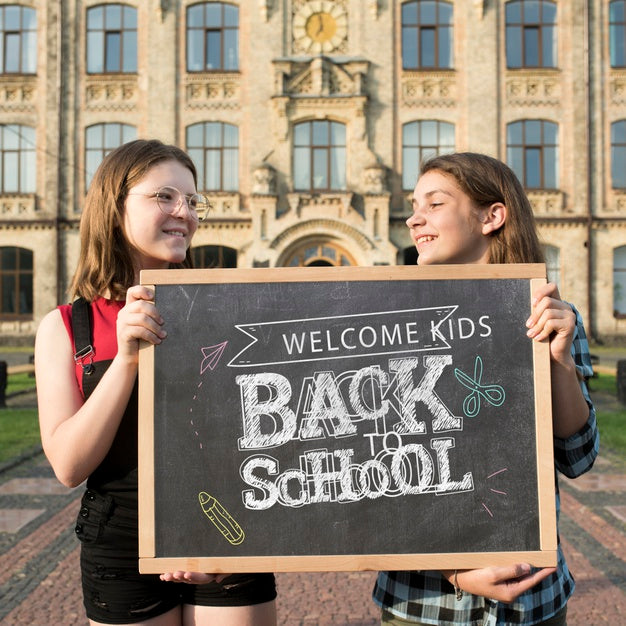 Smiley Girls Holding A Blackboard Mock-Up Psd