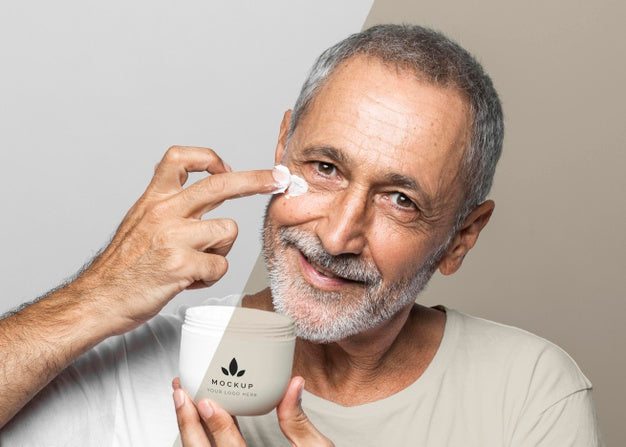 Smiley Senior Man Holding Cream Container Psd