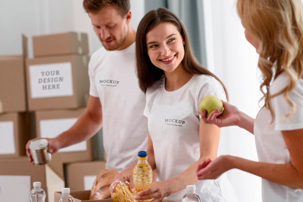 Smiley Volunteers Preparing Boxes Of Provisions For Donations Psd