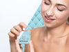 Smiley Woman Holding A Skincare Product Mock-Up Psd