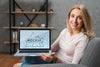 Smiley Woman Holding Laptop On Sofa Psd