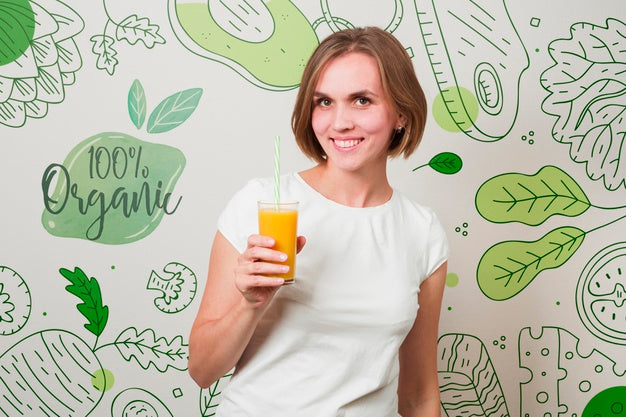 Smiling Woman Holding An Orange Juice Psd