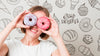 Smiling Woman Looking Through Donuts Psd