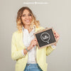 Smiling Woman Presenting Slate Psd