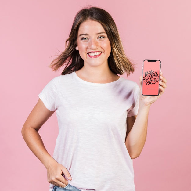Smiling Young Woman Holding A Cellphone Mock-Up Psd