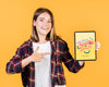 Smiling Young Woman Pointing Finger At A Tablet Mock-Up Psd