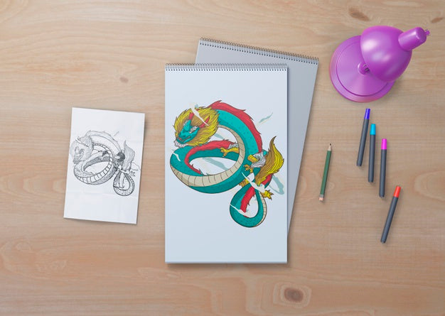 Snake Sketch On White Sheets On Table Psd