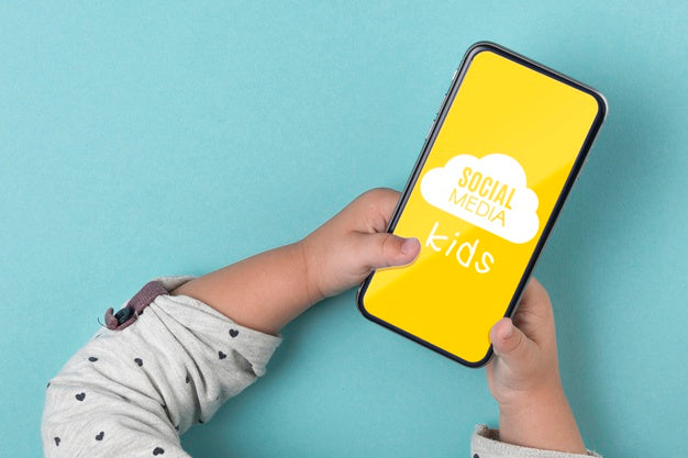 Social Media Concept With Kid Holding Smartphone Psd