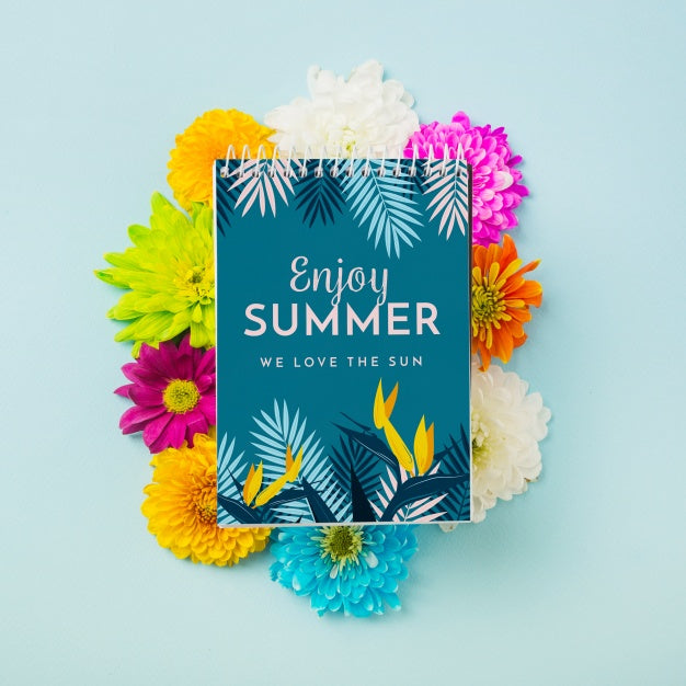 Spiral Notepad Mockup On Colorful Flowers Psd