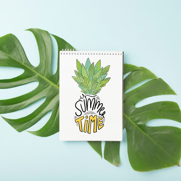 Spiral Notepad Mockup On Palm Leaf Psd