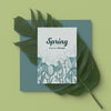 Spring Card With 3D Leaf On Table Psd