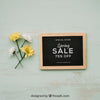 Spring Concept Mockup With Flowers Next To Slate Psd
