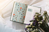 Spring Concept Mockup With Open Book And Flowers Psd