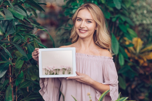 Spring Concept With Woman Holding Tablet Mockup Psd