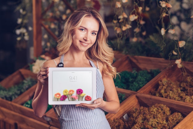 Spring Concept With Woman Holding Tablet Mockup Psd