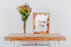 Spring Mockup With Frame And Vase Of Flowers Over Table Psd